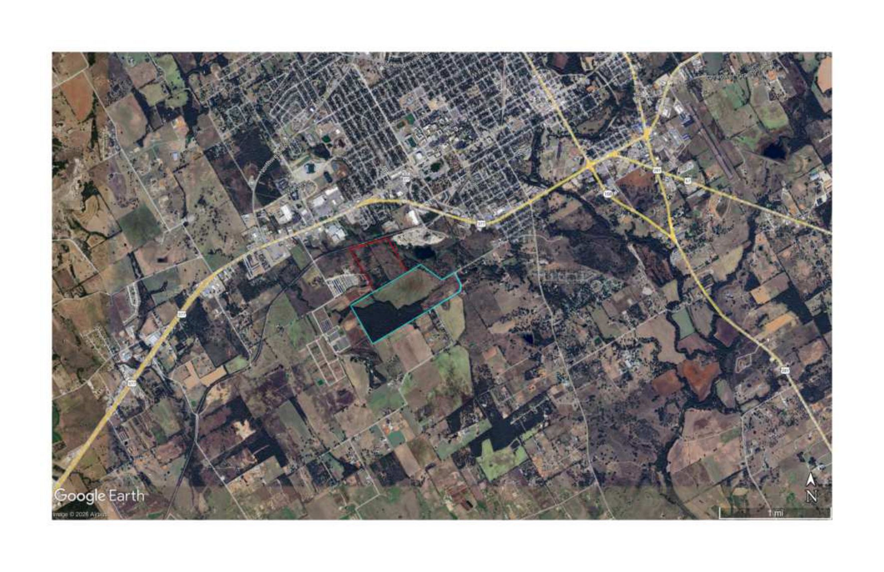 Satellite image of Stephenville showing the site south of the city and railroad.